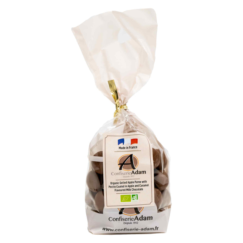 Organic Gelled apple puree with pectin coated in apple and caramel-flavoured milk chocolate